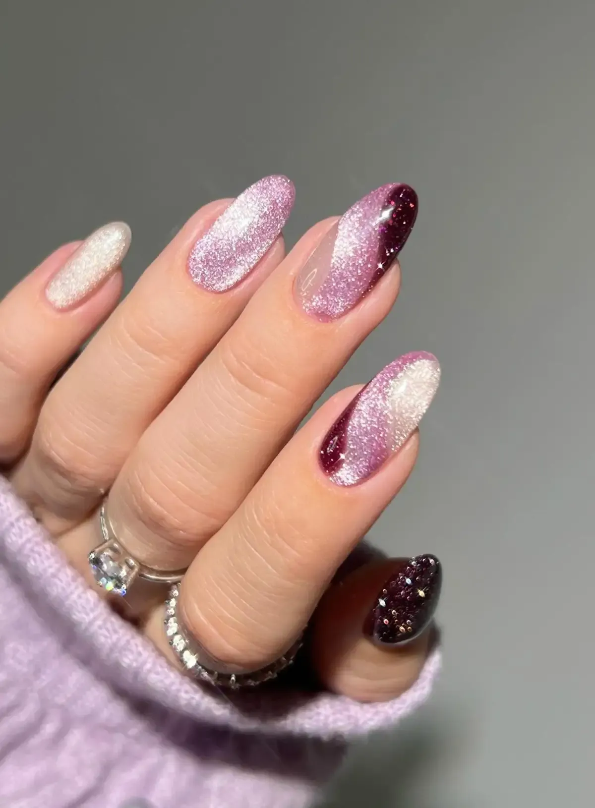 Pink and burgundy cat eye nails.