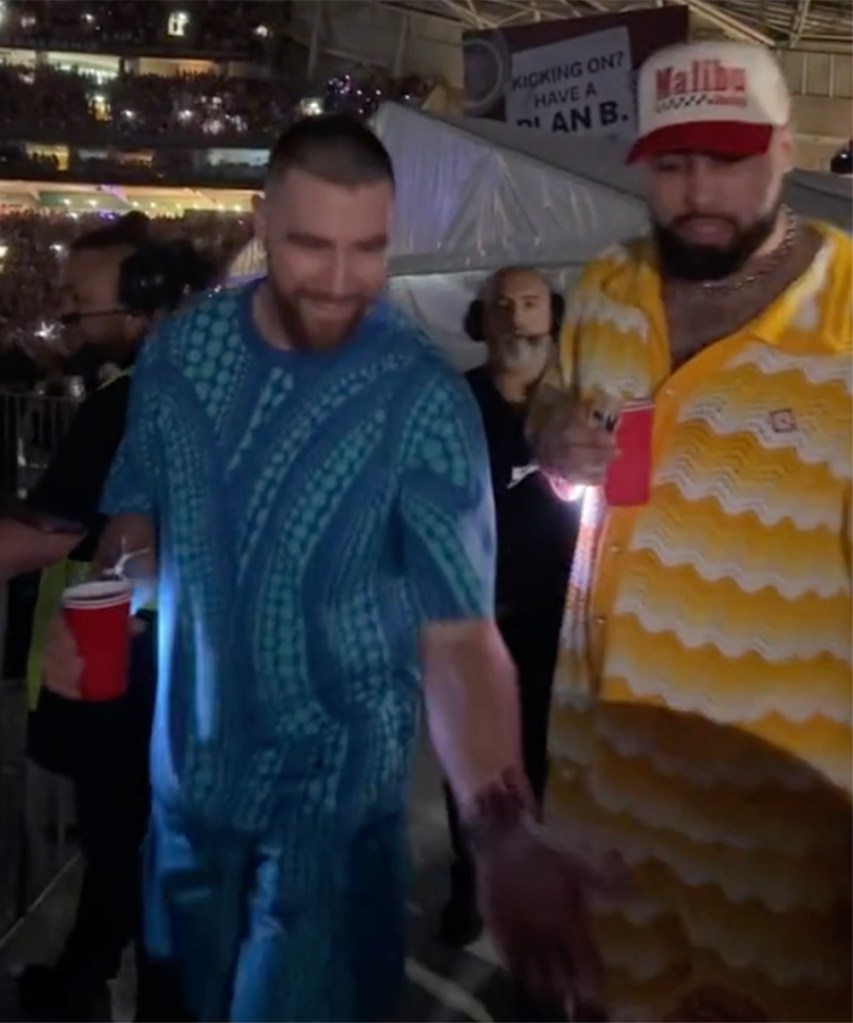 Travis Kelce and Ross Travis interacting with fans at Taylor Swift's show in Sydney, Australia on Friday, February 23, 2024.