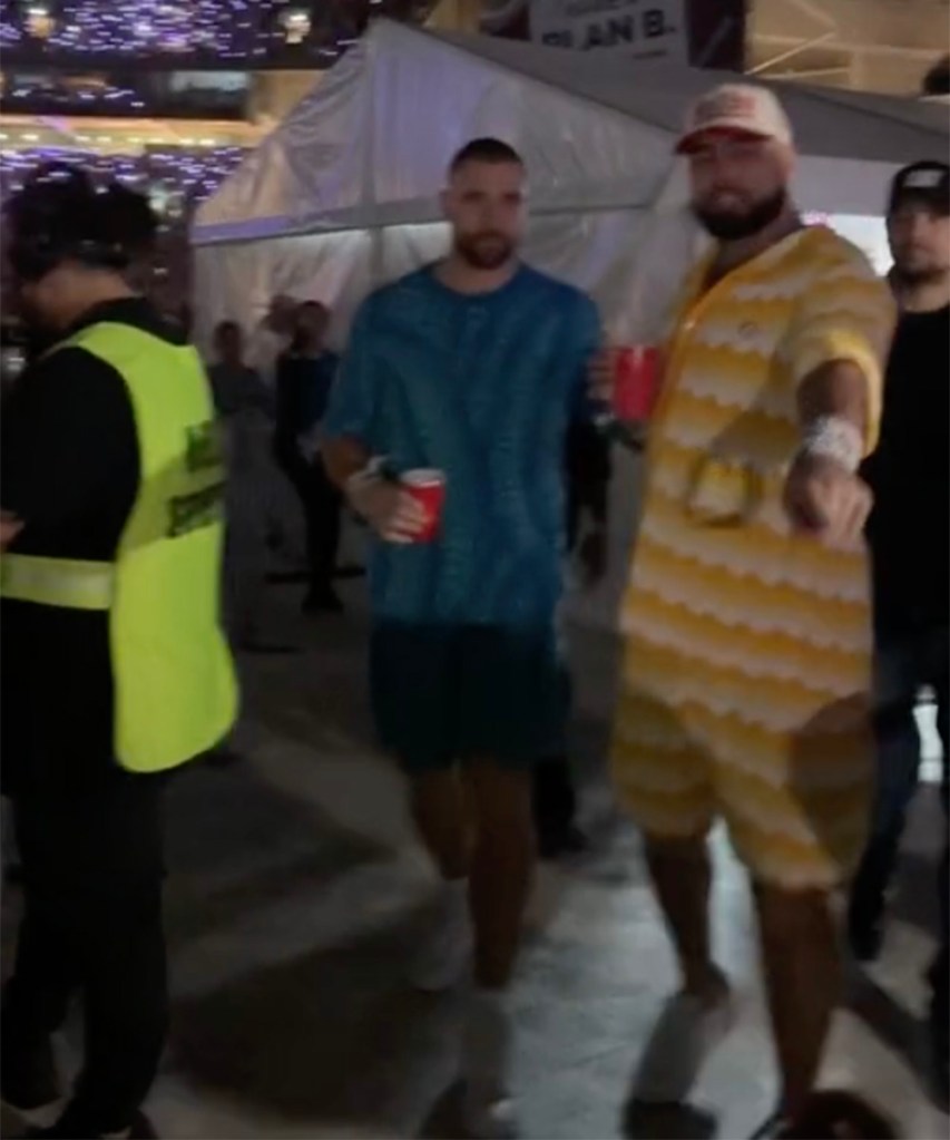 Travis Kelce and Ross Travis interacting with fans at Taylor Swift's show in Sydney, Australia on Friday, February 23, 2024.