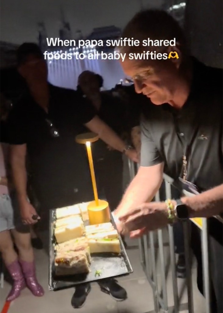 Taylor Swift's dad Scott handing out sandwiches to fans at her show in Sydney, Australia on Friday, February 23, 2024.