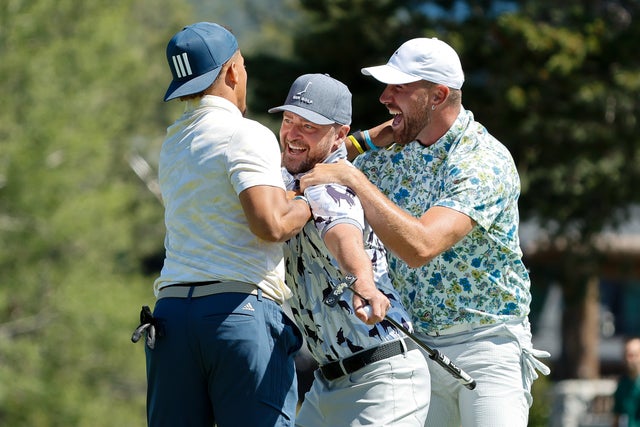 NFL football players Travis Kelce, Patrick Mahomes, and musician Justin Timberlake reacts to Kelce making a putt for an eagle on the 18th hole during Round One of the 2022 American Century Championship at Edgewood Tahoe Golf Course on July 8, 2022 in Stateline, Nevada.