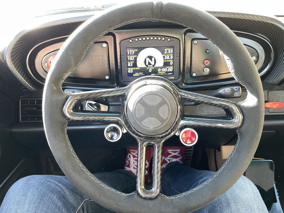 a steering wheel and dashboard of a car