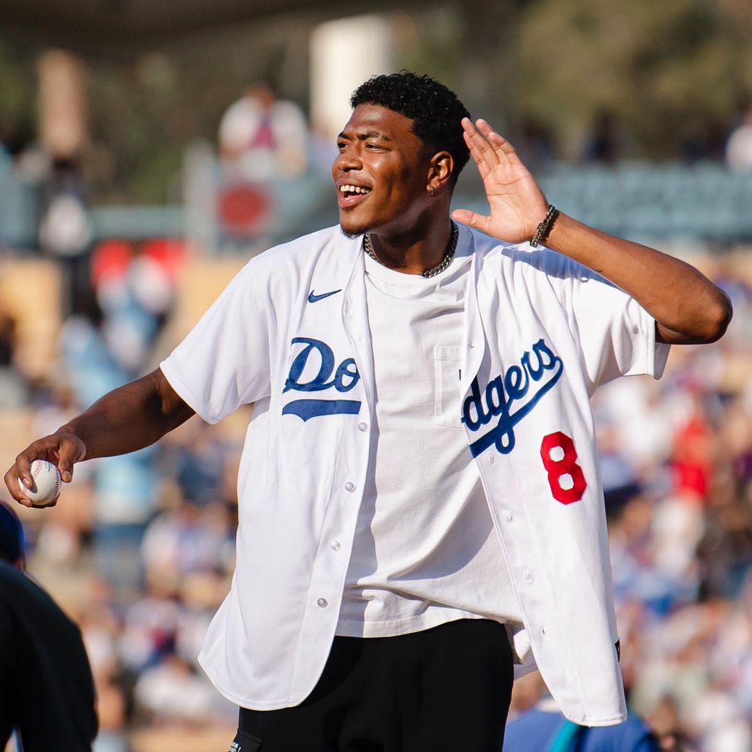 Rui Hachimura at a baseball game with the LA Dodgers, surrounded by family joy to welcome Shohei Ohtani