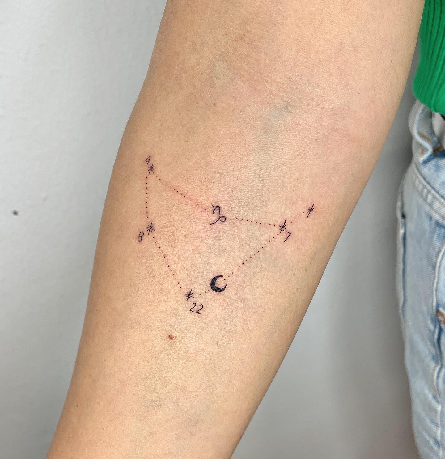 Capricornus constellation tattoo located on the inner forearm