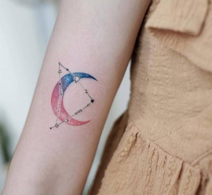 Capricorn constellation and crescent moon tattoo on the bicep