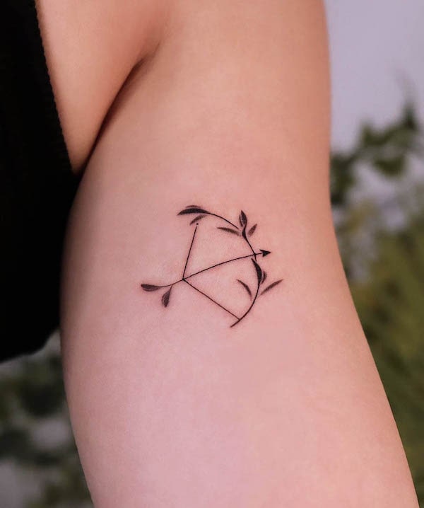 Simple bow and arrow tattoo by @noul_tattoo