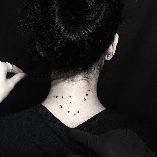 Minimalist Capricorn constellation tattoo on the nape