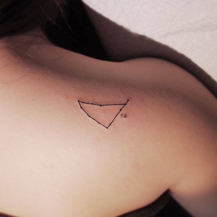 Minimalistic Capricornus constellation tattoo on the right shoulder blade