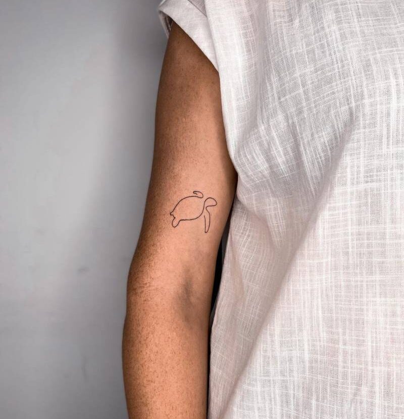 Minimalist one line turtle tattoo on the arm