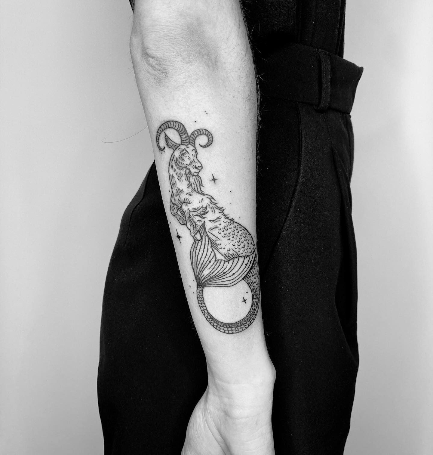 Sea goat tattoo located on the forearm