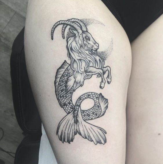 Sea goat tattooed on the thigh