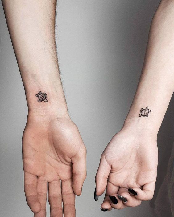 Tiny sea turtle couple tattoo on the wrist