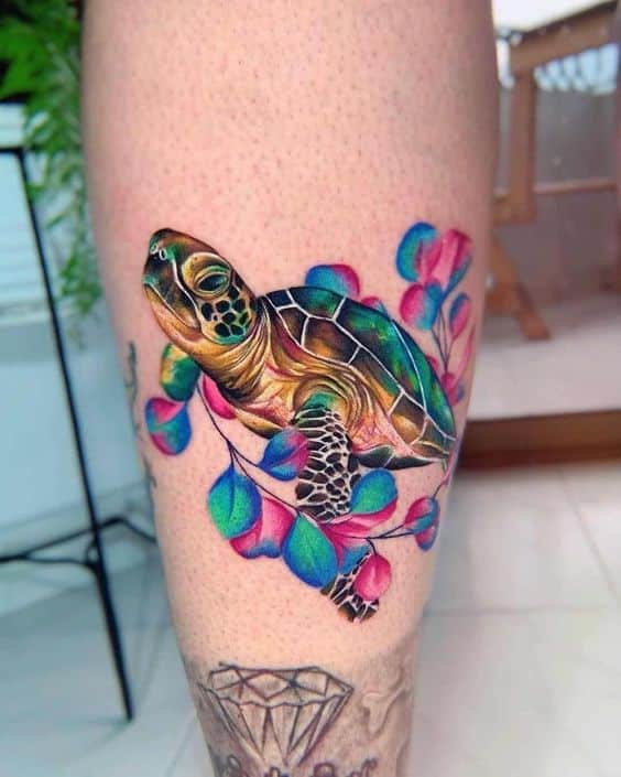 Watercolor style sea turtle tattoo on the calf
