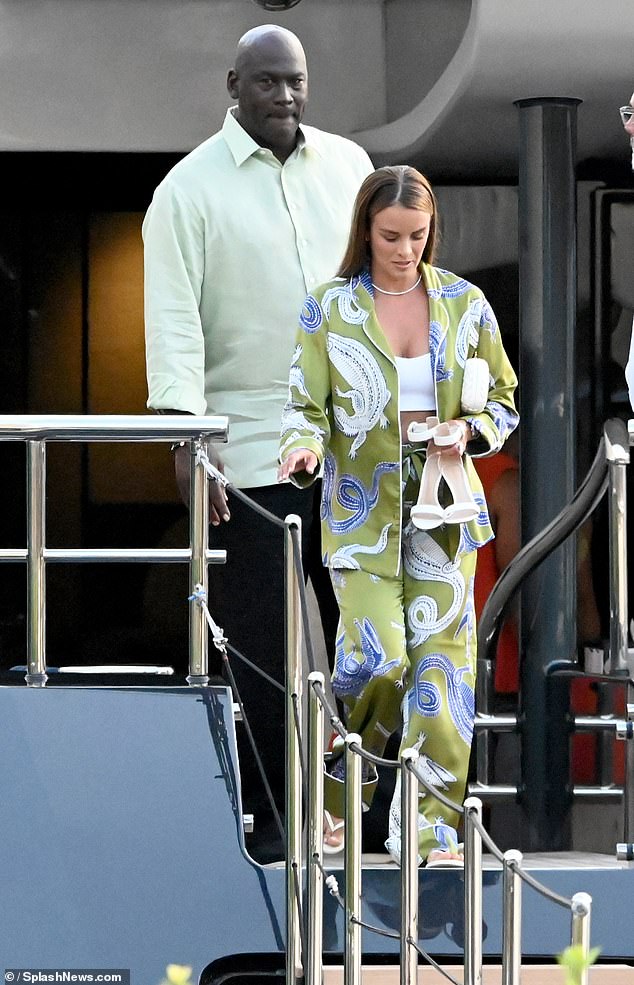 Michael Jordan and wife Yvette Prieto opted for matching outfits as they left the basketball legend's luxury $15million yacht to enjoy a romantic meal in Barcelona