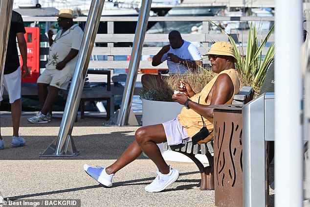 Jackson was able to sneak off for a moment. Johnson and, possibly, Cedric the Entertainer appear to be in the background of this shot in Saint-Tropez