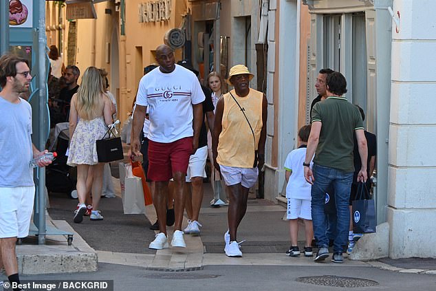 Magic Johnson and actor Samuel Lee Jackson are seen walking through Saint-Tropez