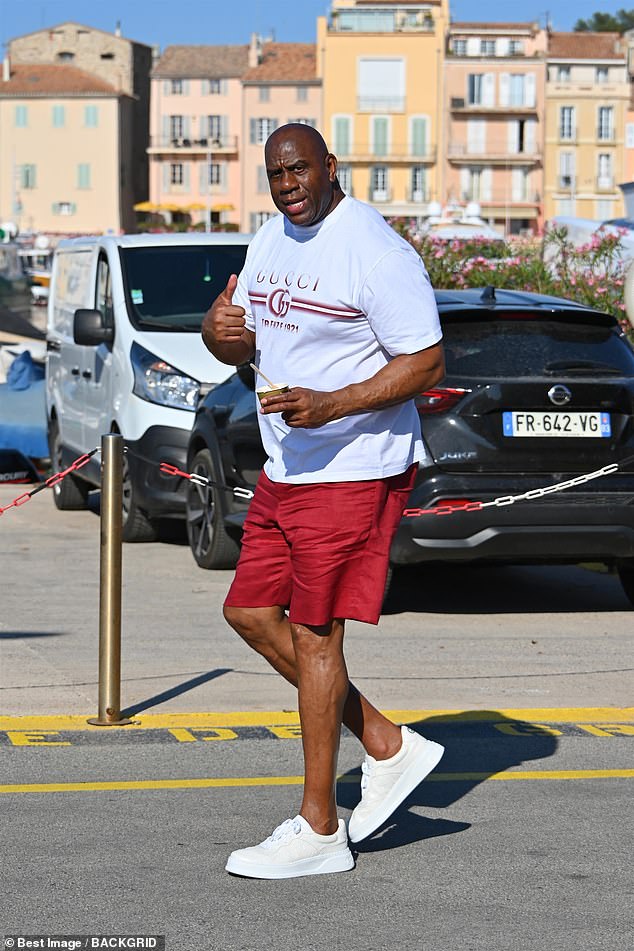 Five-time NBA champion Magic Johnson gives a 'thumbs up' to a cameraperson in France