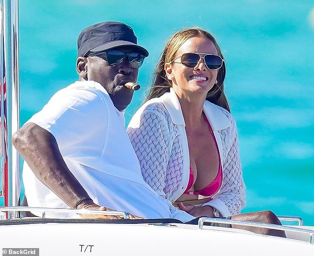 Jordan is seen smoking a cigar as they headed out on a boat near the Ligurian sea