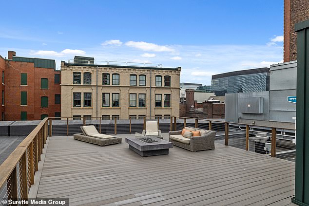 The unit even includes a private roof deck in the heart of the Boston Seaport neighborhood