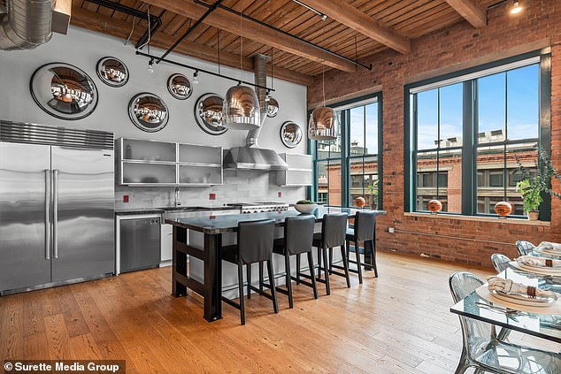 This penthouse also includes a spacious eat-in kitchen with top-of-the-line appliances