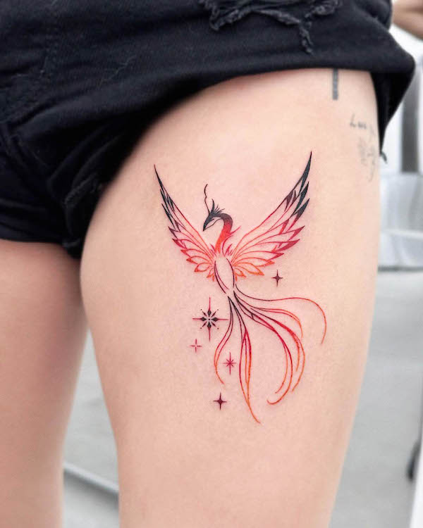 Black and red phoenix tattoo by @e.hyang_.tattoo