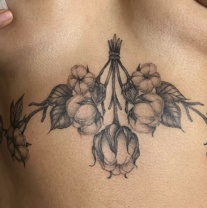 upside down bouquet tattoo on sternum
