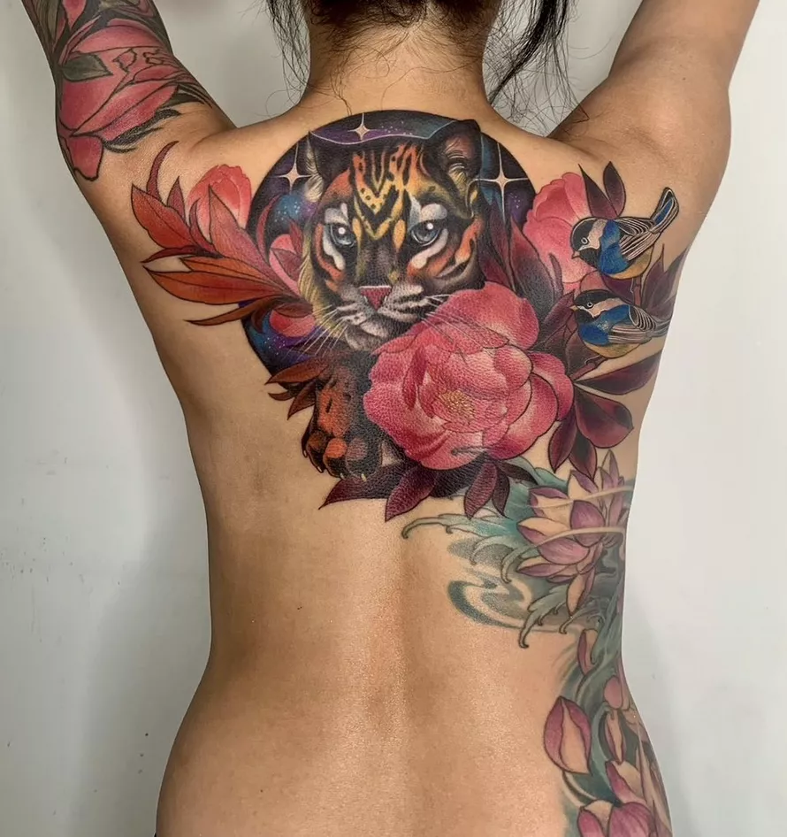 flora and fauna rose tattoo on back