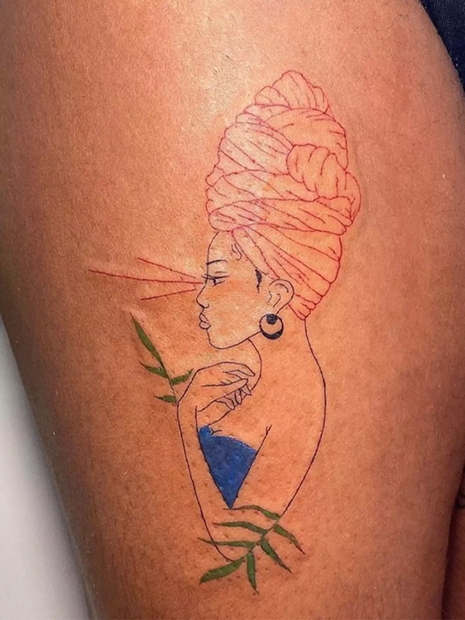 woman with headwrap tattoo