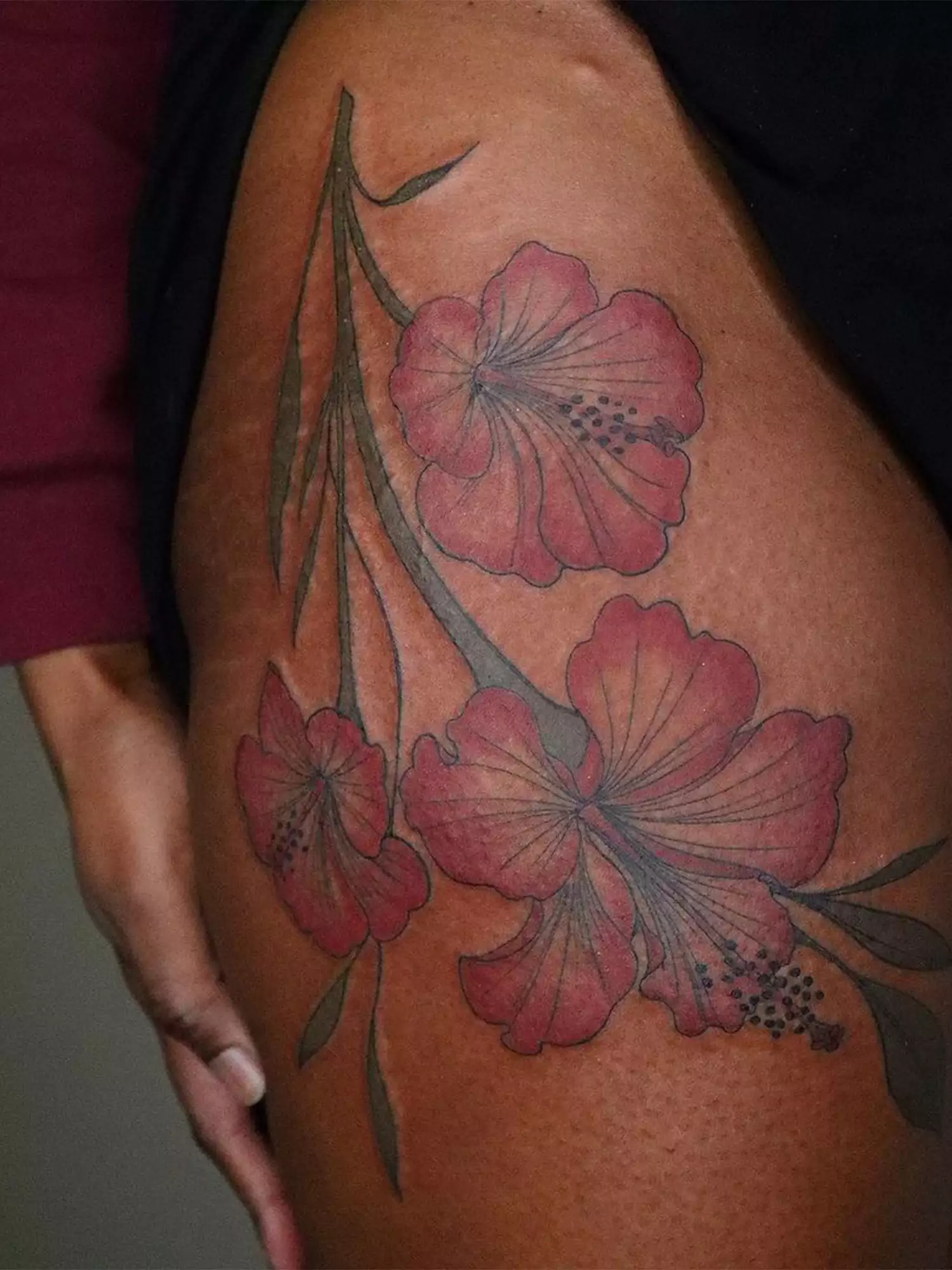 flower tattoos on upper thigh