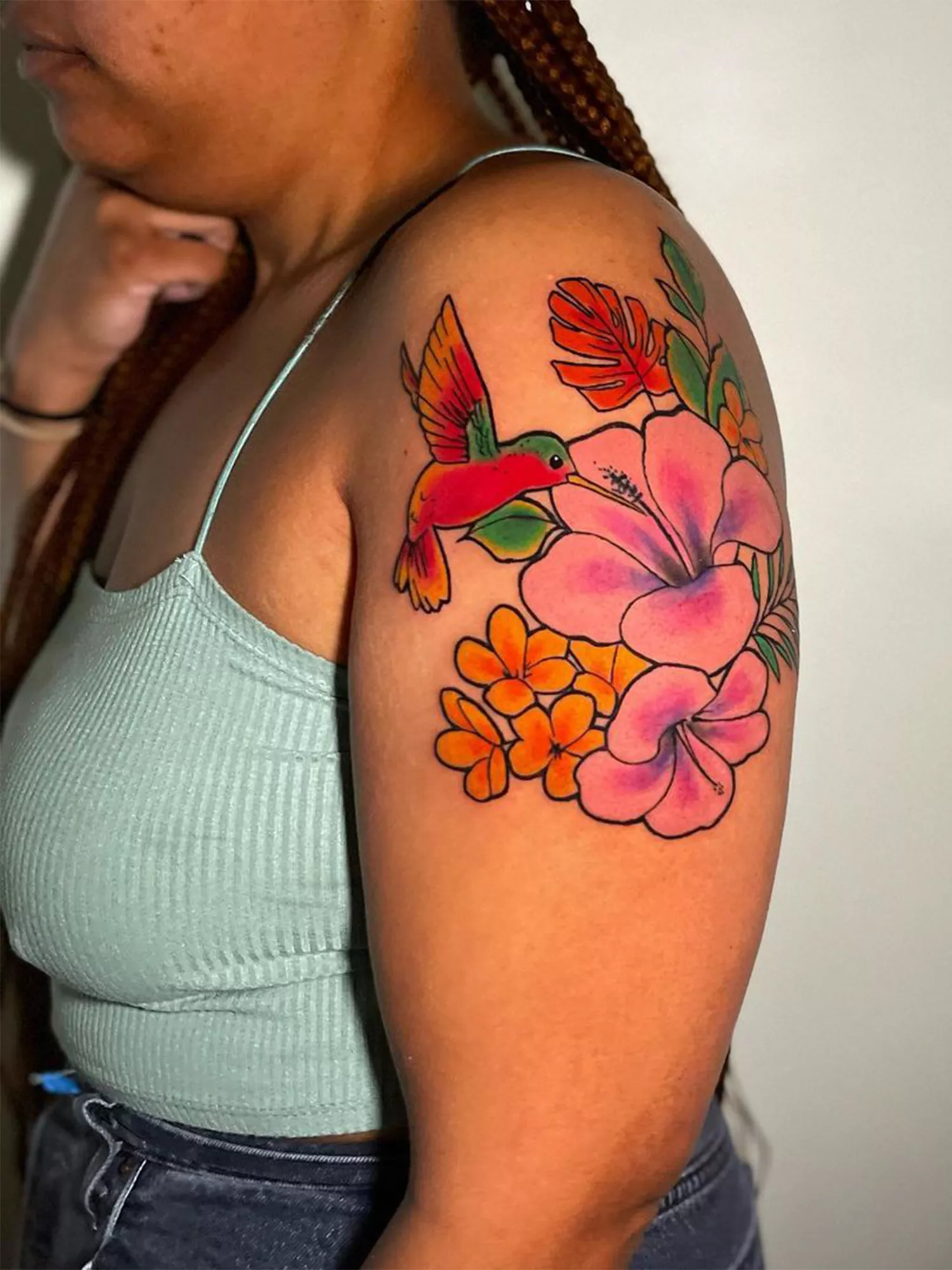 floral arrangement with bird tattoos