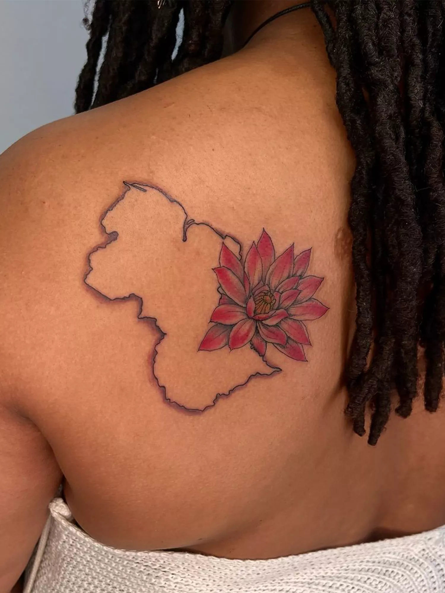 state outline tattoo with flower design