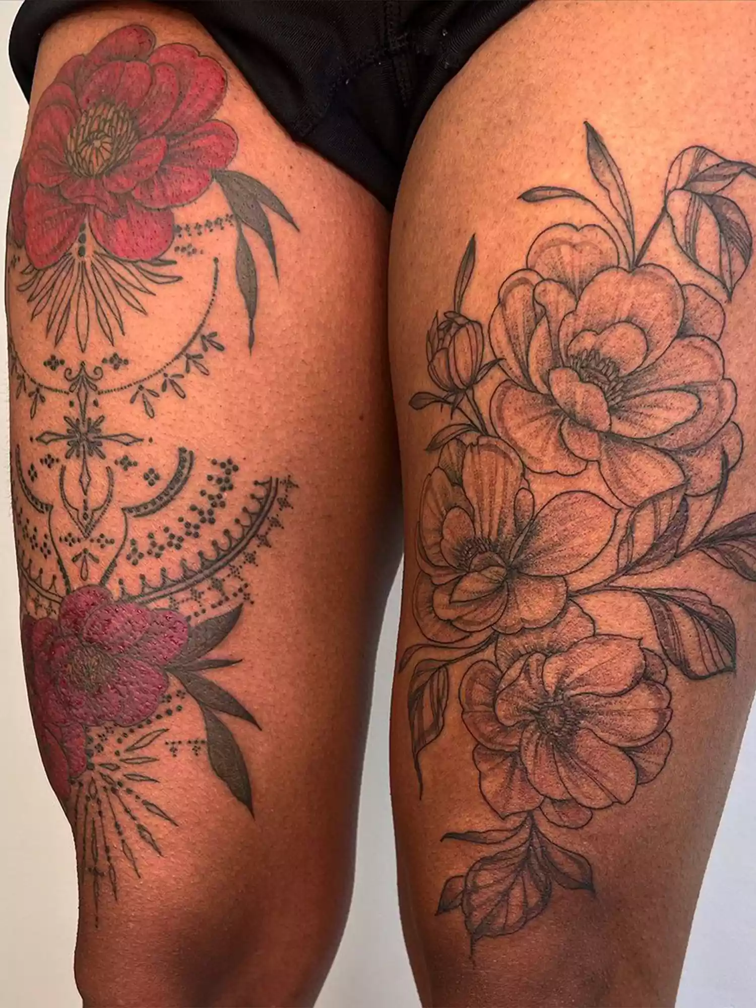 floral thigh tattoos