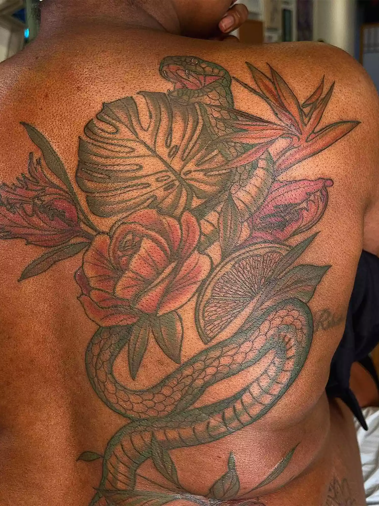 flowers and snake tattoo