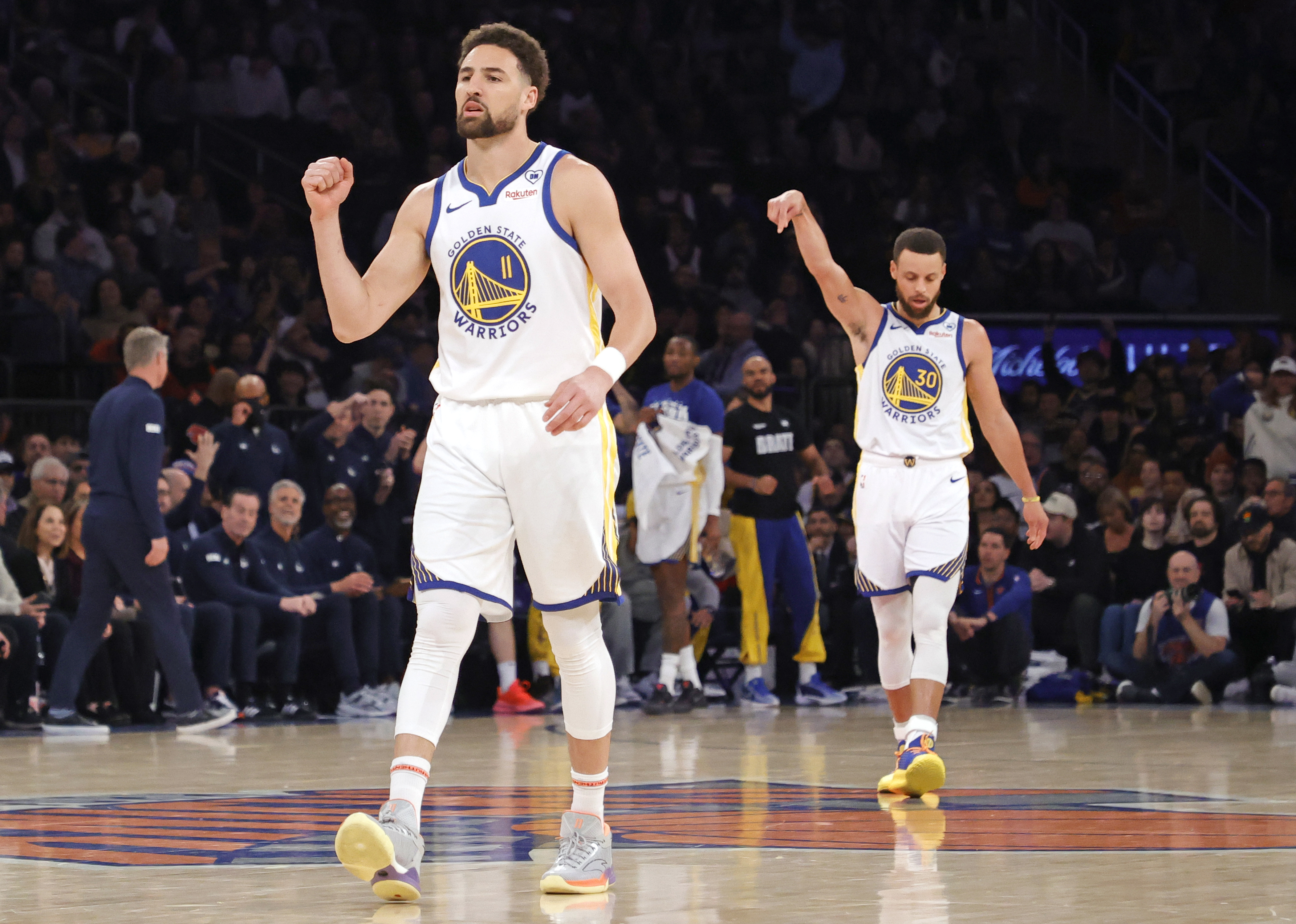 Warriors guard Klay Thompson and Warriors guard Stephen Curry react after scoring during the first quarter against the Knicks on February, 29, 2024.