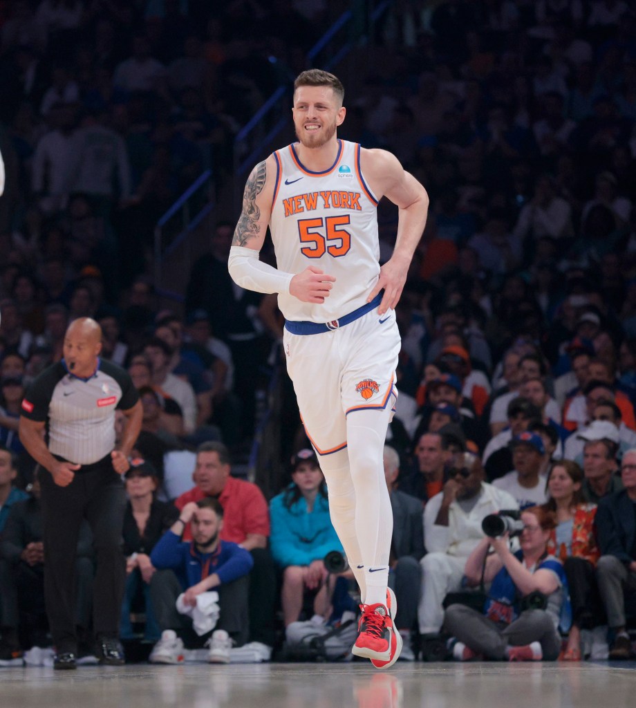 Knicks center Isaiah Hartenstein #55 is all smiles as he runs down court after scoring during the first quarter of Game 7 against the Pacers in the second round of the playoffs on May 19, 2024. 
