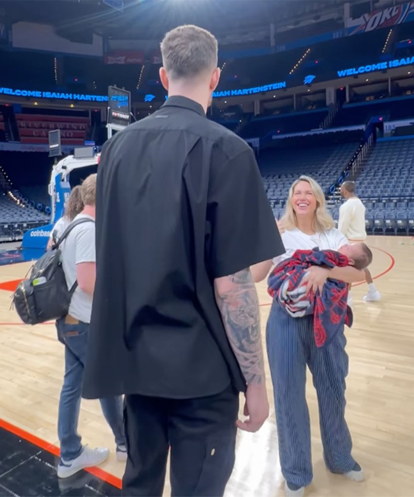 Isaiah Hartenstein and his wife Kourtney Kellar with their son on his signing day at Paycom Center in OKC.