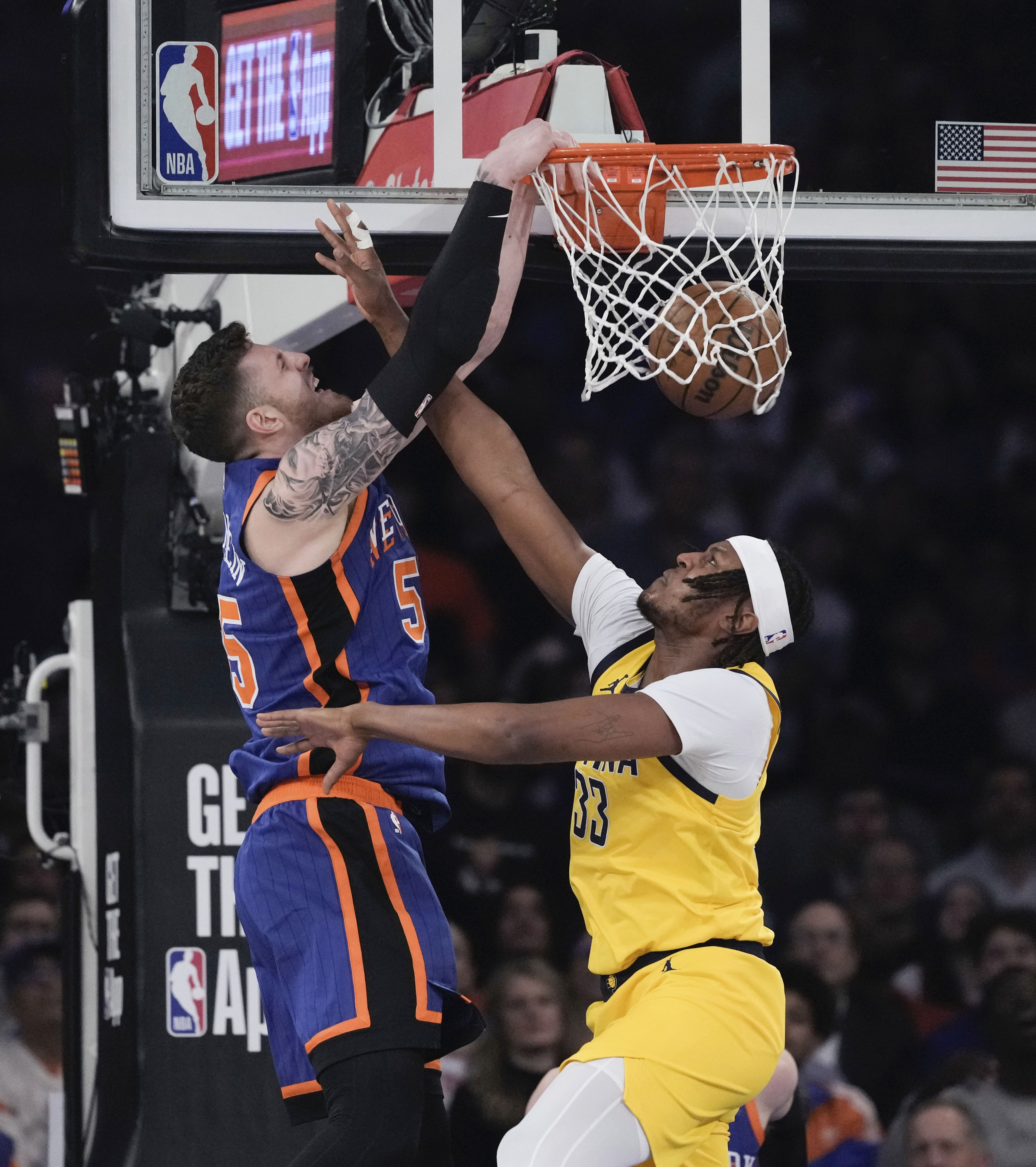 New York Knicks' Isaiah Hartenstein, left, dunks the ball in front of Indiana Pacers' Myles Turner during the first half of Game 5 in an NBA basketball second-round playoff series, Tuesday, May 14, 2024, in New York.
