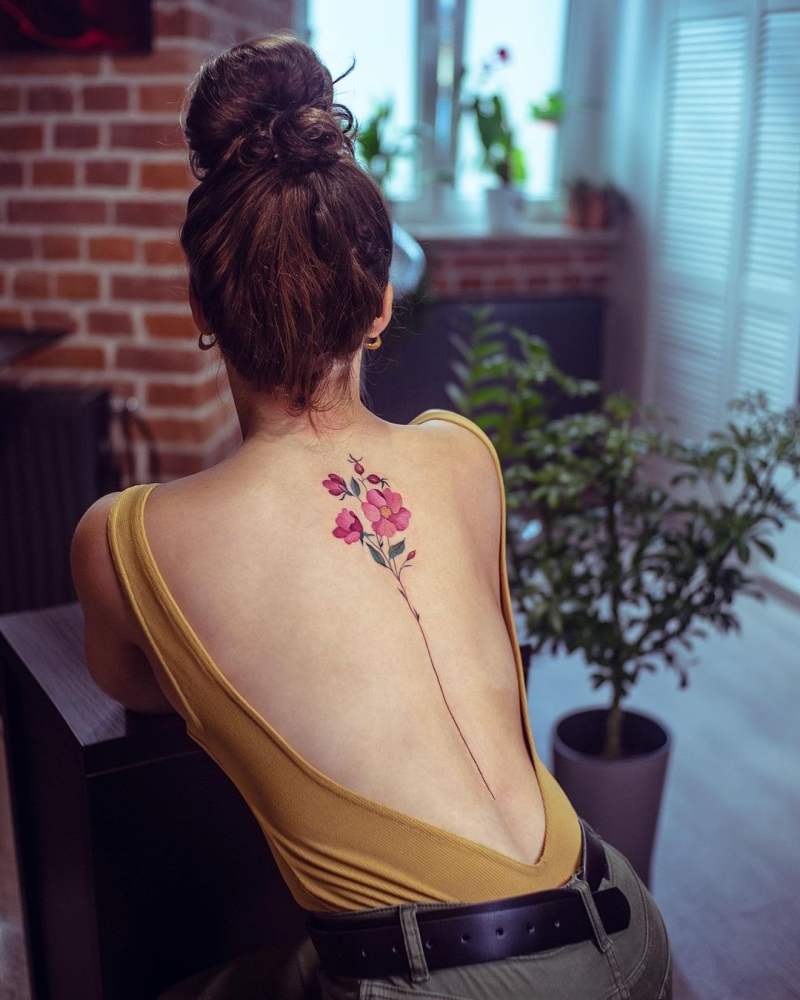 floral spine tattoo