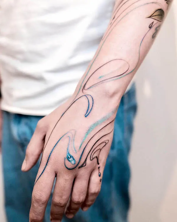 Glowing water hand tattoo by @gagama