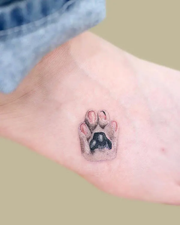 Realism paw tattoo by @tattoo.pencil