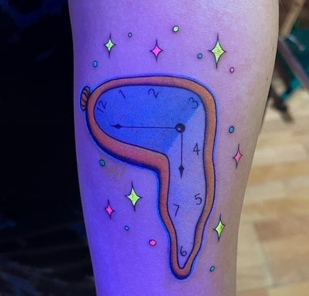 melted clock invisible tattoo design