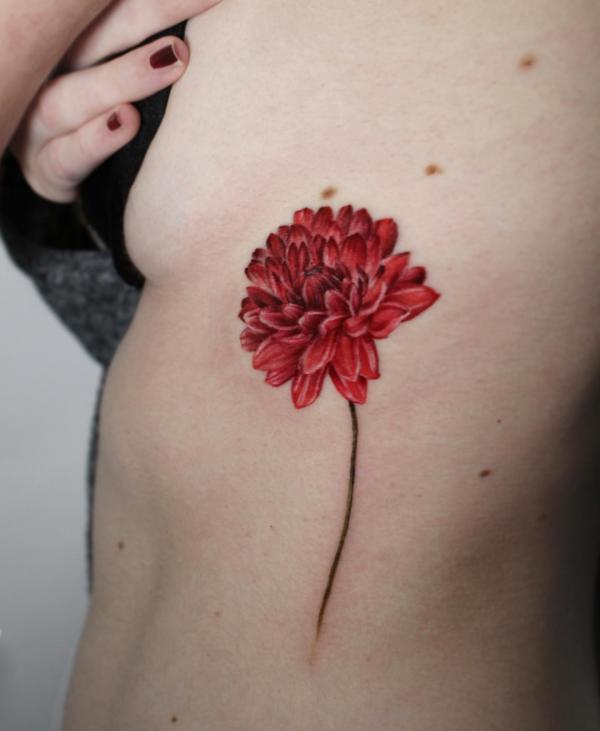 A stem of dahlia side tattoo