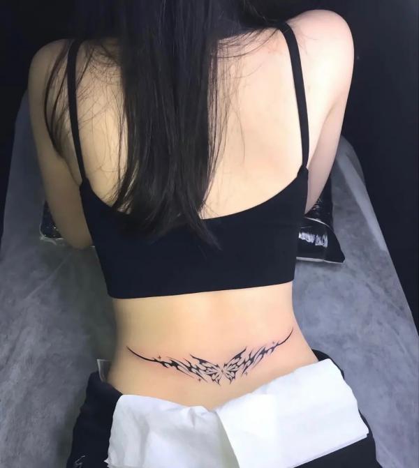 Butterfly cyber sigilism tattoo low back