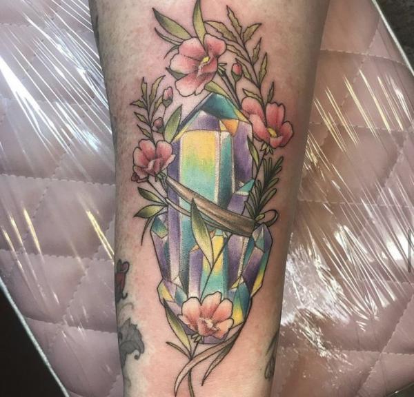 Crystal with flowers tattoo forearm