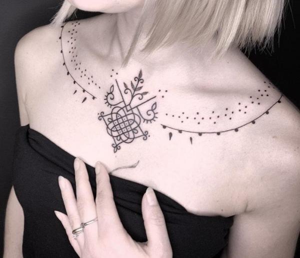 Feminine ornamental necklace tattoo