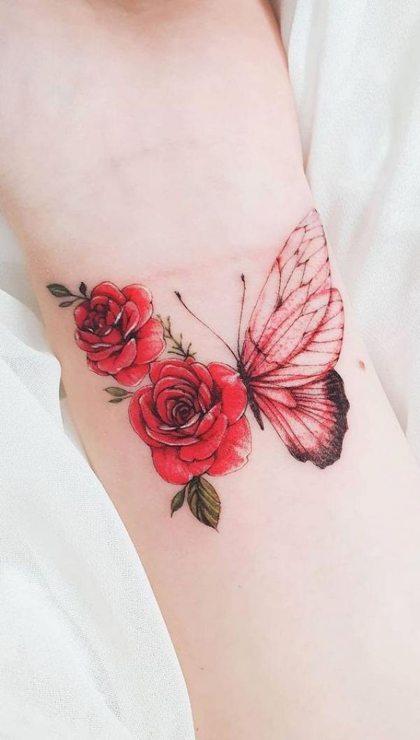 Half red butterfly half red roses tattoo