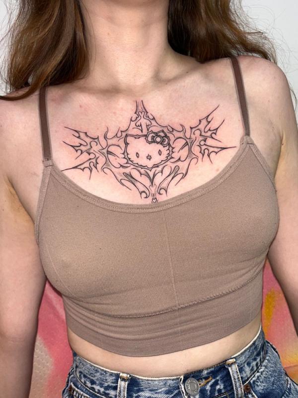 Hello Kitty cyber sigilism chest tattoo