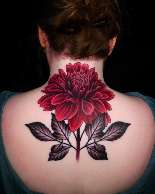 Large dahlia tattoo on upper back