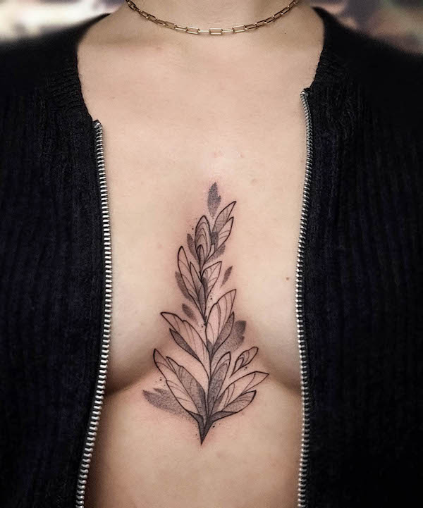 Leaves between breast tattoo by @melli.mrk_.tattoo