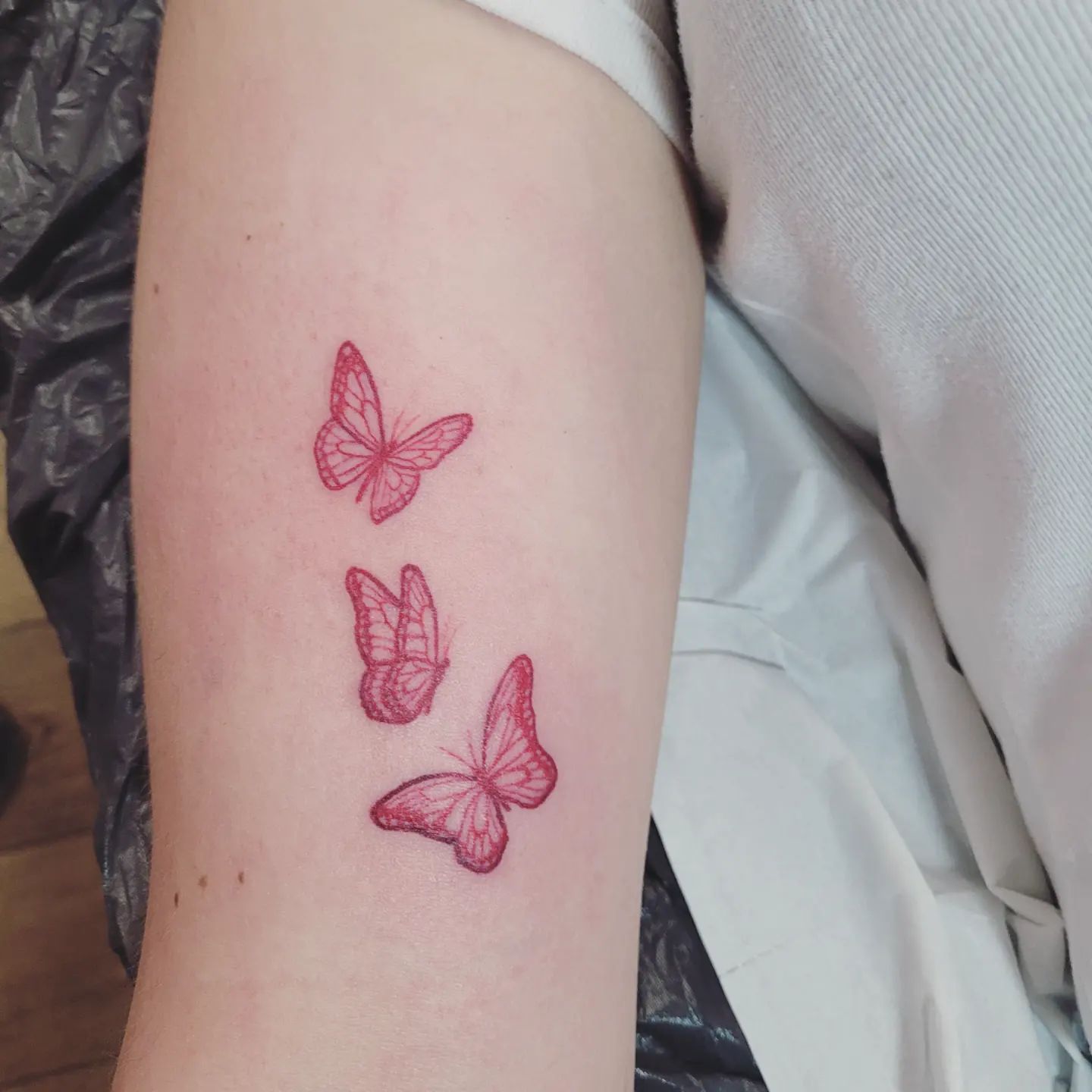 Three butterflies tattoo on arm